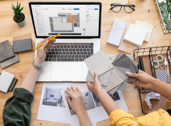 Interior designer consulting client on custom art