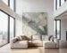 Large textured acoustic art installed in a modern luxury loft with high ceilings.