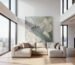 Large textured acoustic art installed in a modern luxury loft with high ceilings.