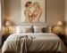 Heavily textured abstract lovers art painting hanging above a bed in a romantic master bedroom.